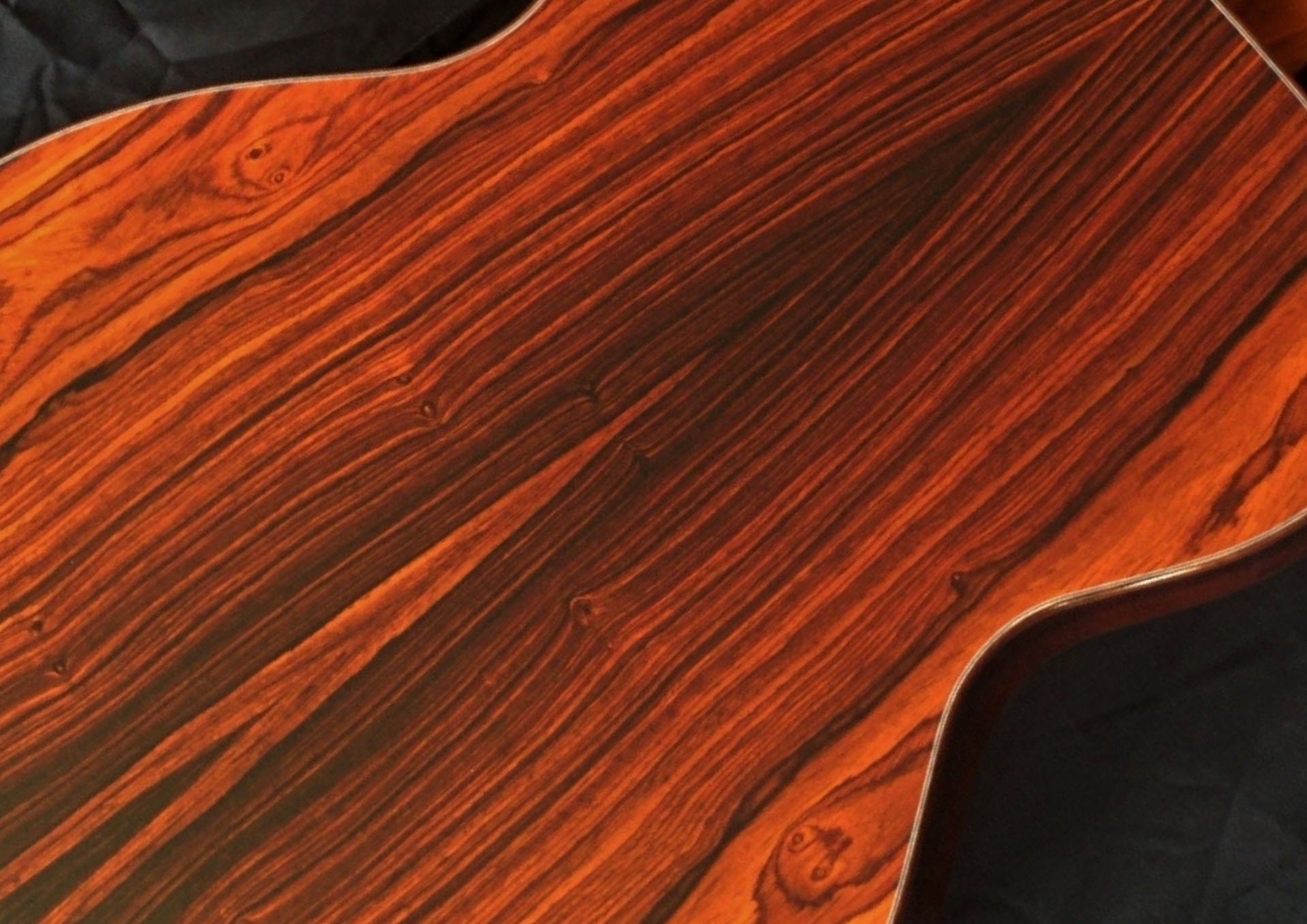 Northwood acoustic guitar back featuring beautiful cocobolo grain.