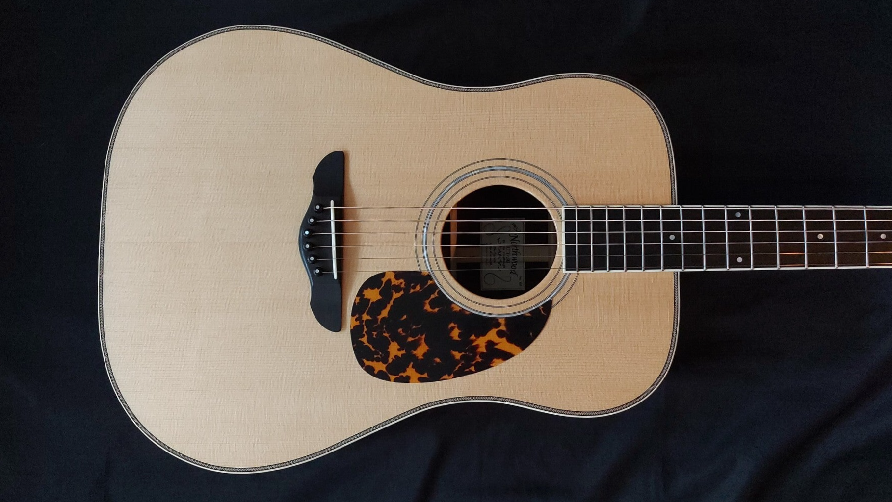 Northwood guitars Dreadnought acoustic guitar model with Sitka spruce soundboard and tortoiseshell pickguard.