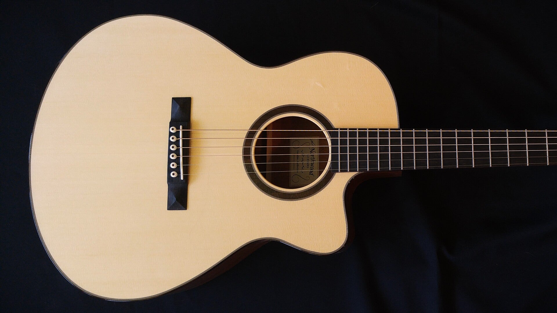 Northwood guitars Venetian cutaway Auditorium model acoustic guitar with mahogany back and sides and spruce top.