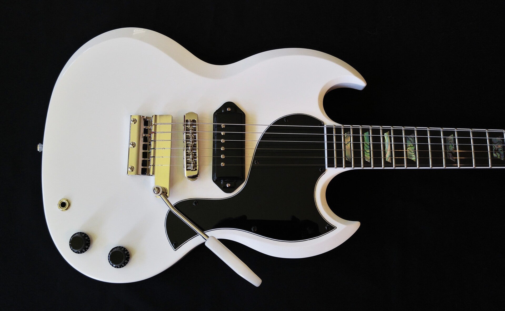Northwood Guitars white neck-thru SG style electric guitar with custom Seymour Duncan pickup, abalone trapezoid inlays and Vibrola tremolo
