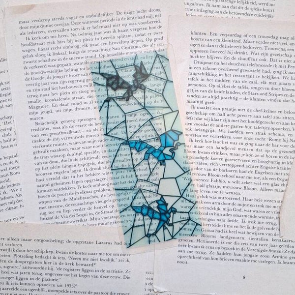 Drie draken glas in lood boekenlegger