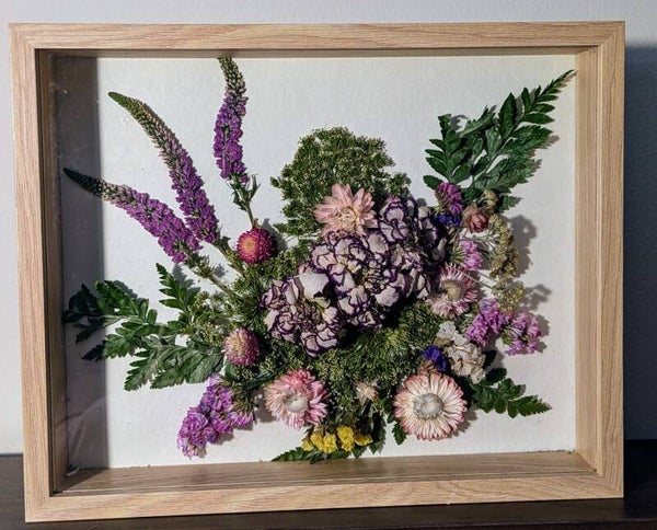 Pressed and dried flowers, floral art in a frame