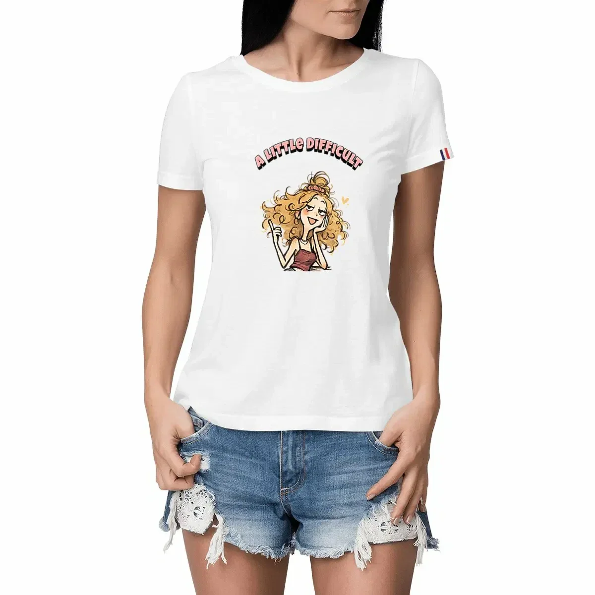 White women’s t-shirt featuring the “A Little Difficult” doodle girl illustration with quirky indie aesthetic and expressive character design.