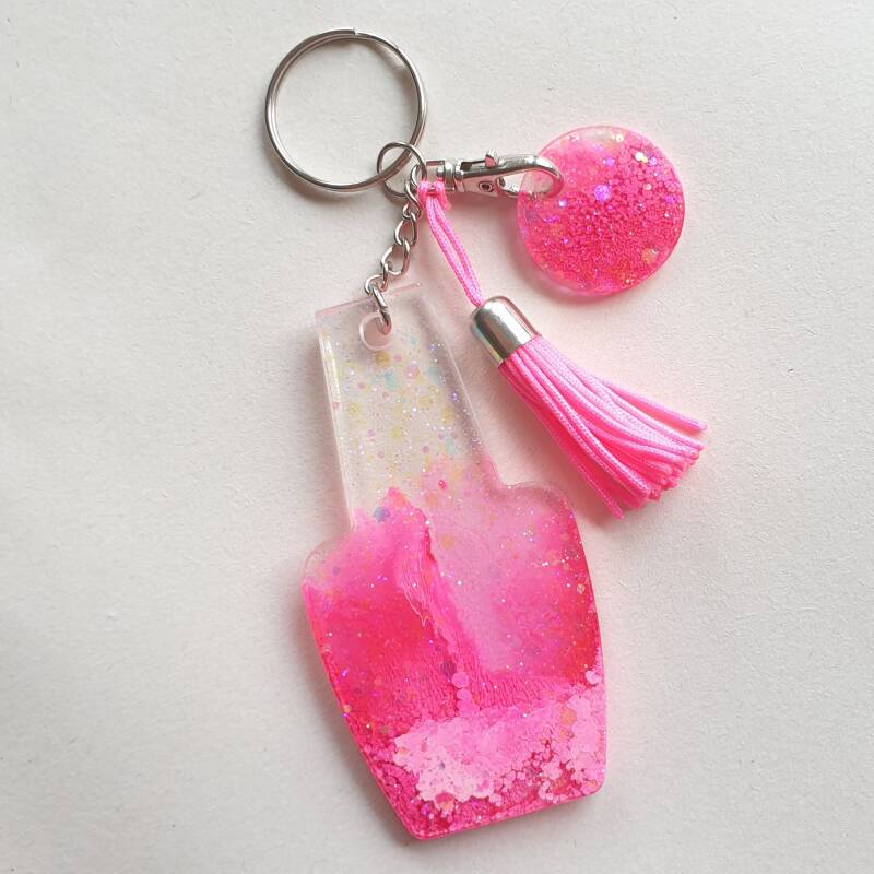 sleutelhander in de vorm van een nagellakflesje, roze