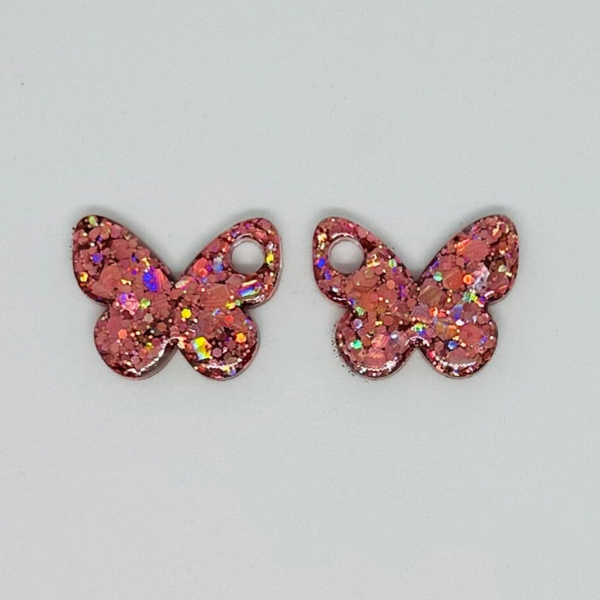 Pampille papillon rose pailletée