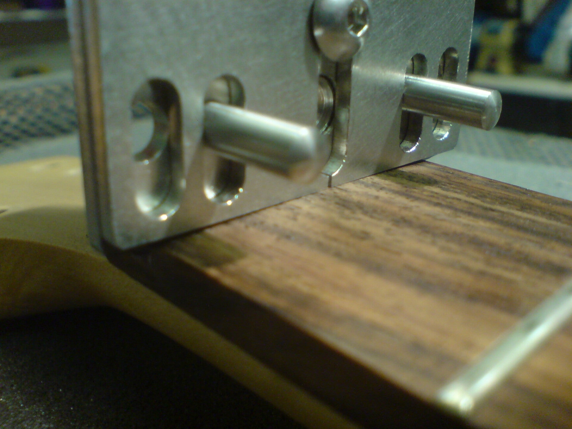 GMC Luthier Tools Nut Replacement jig shown checking the nut slot depth on a guitar.