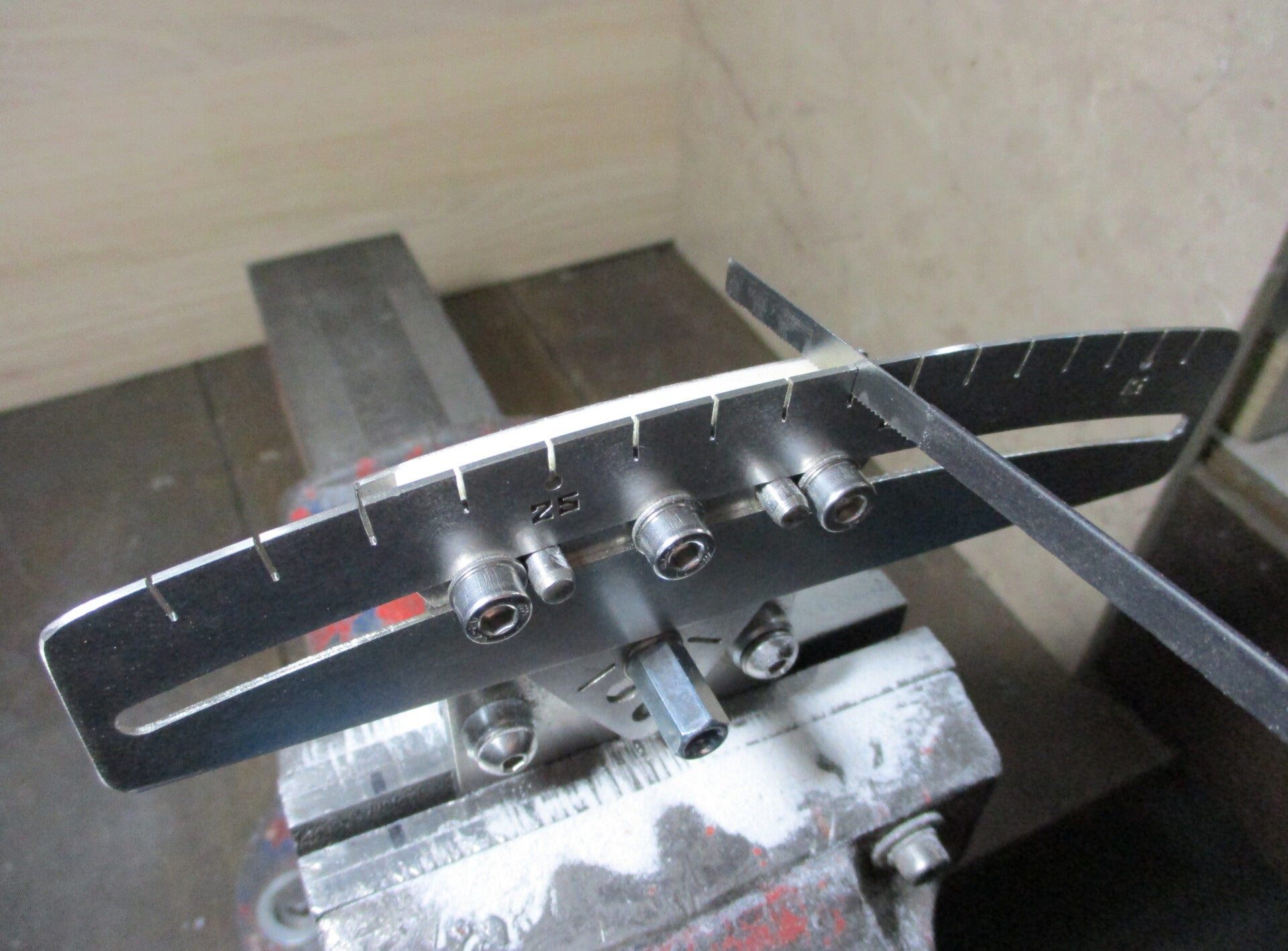 GMC Luthier Tools String Spacing Guide with razor saw marking the string slots for a custom guitar nut.