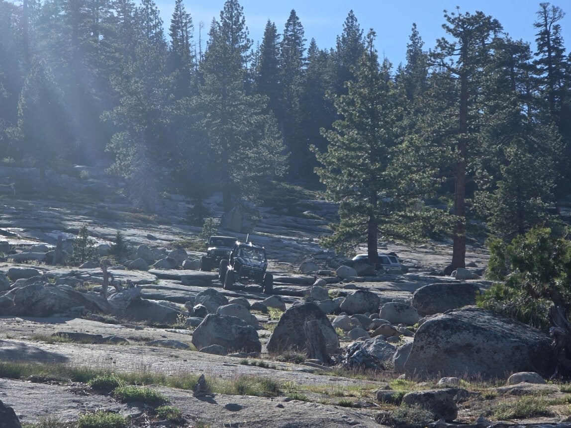 Jeeps crossing open granite on a Boswell Extreme tour
