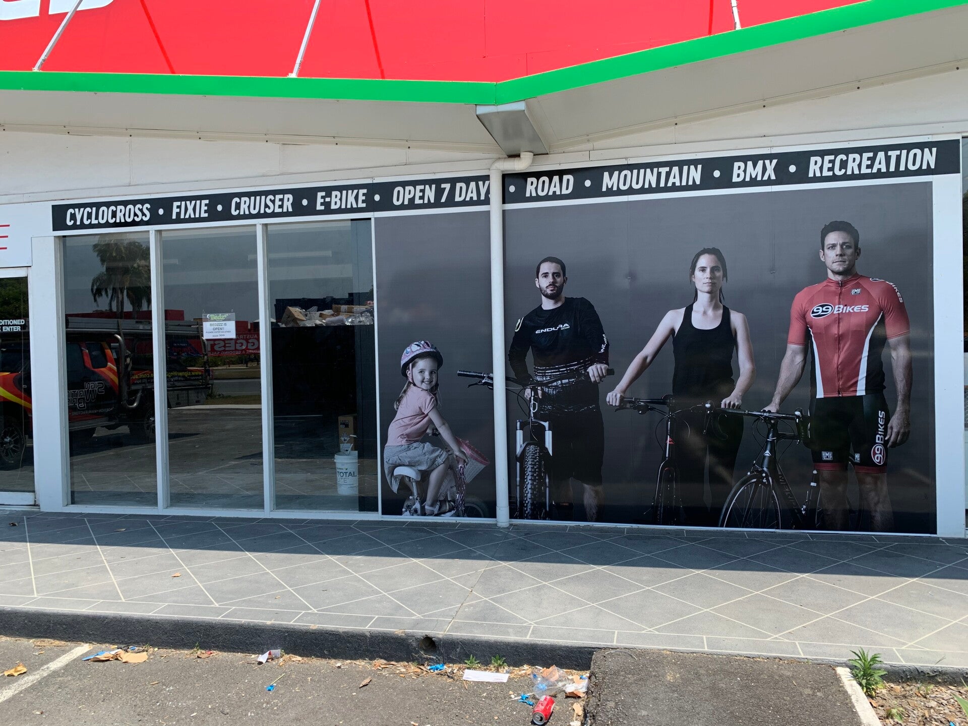 Commercial window signage and shopfront branding in Brisbane, showcasing frosted or opaque vinyl lettering for retail grocery store windows.