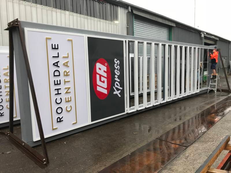 Custom sign fabrication in Brisbane, showcasing a large Rochedale Central pylon sign frame with an IGA Xpress logo, designed and manufactured by Brisbane signwriters.