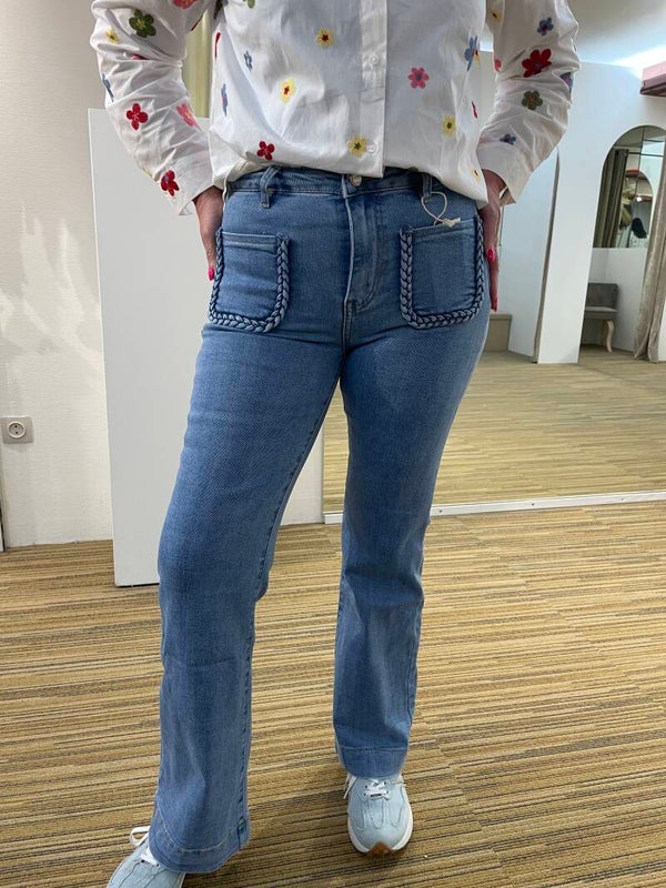 Jeansbroek met vlecht op de zakjes