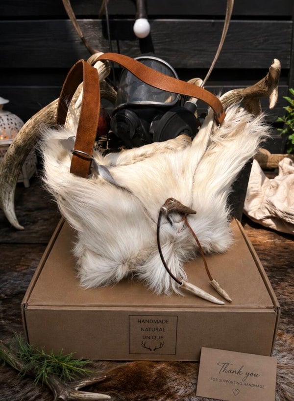 Handcrafted Goat Skin Bag with Long Leather Shoulder Strap and an Antler Toggle