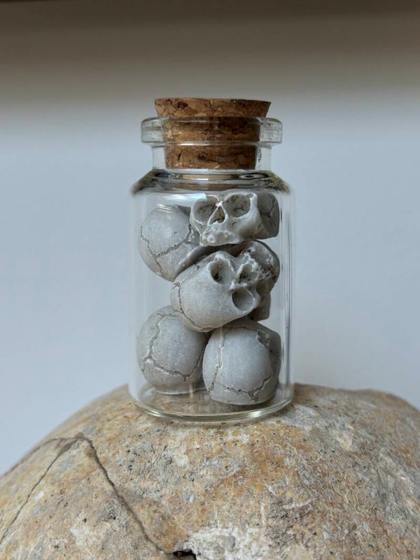 Glass Apothecary Bottle of Skulls