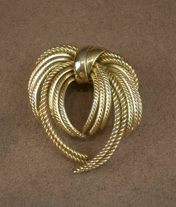Broche en métal doré Noeud signée Grossé Germany