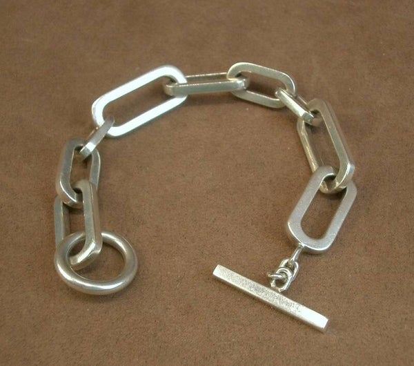 Important bracelet en argent massif anneaux asymétriques 74,30g