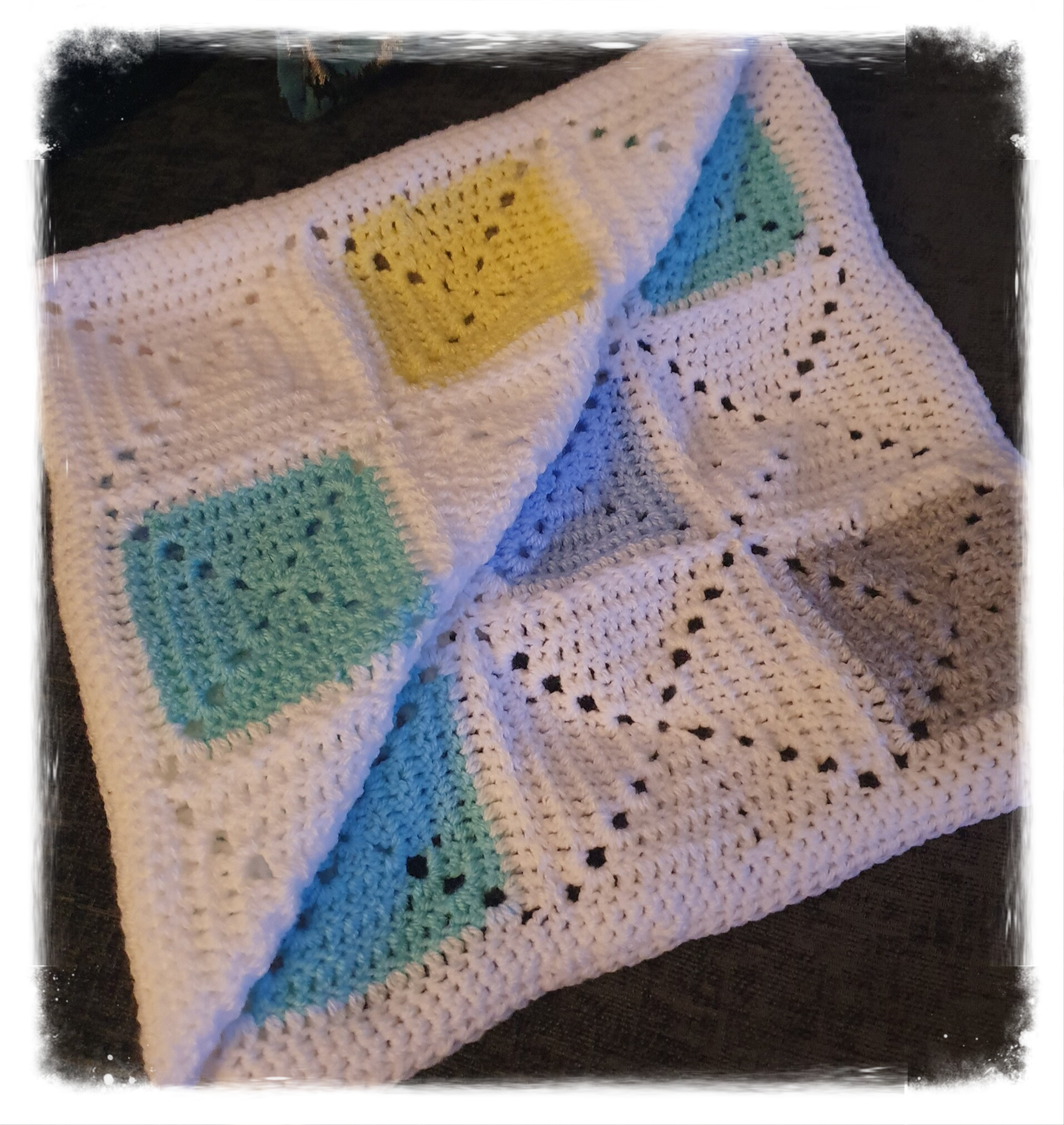 Pastel coloured patchwork baby blanket