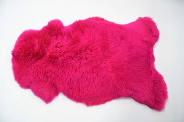 Gekleurde schapenvacht roze.