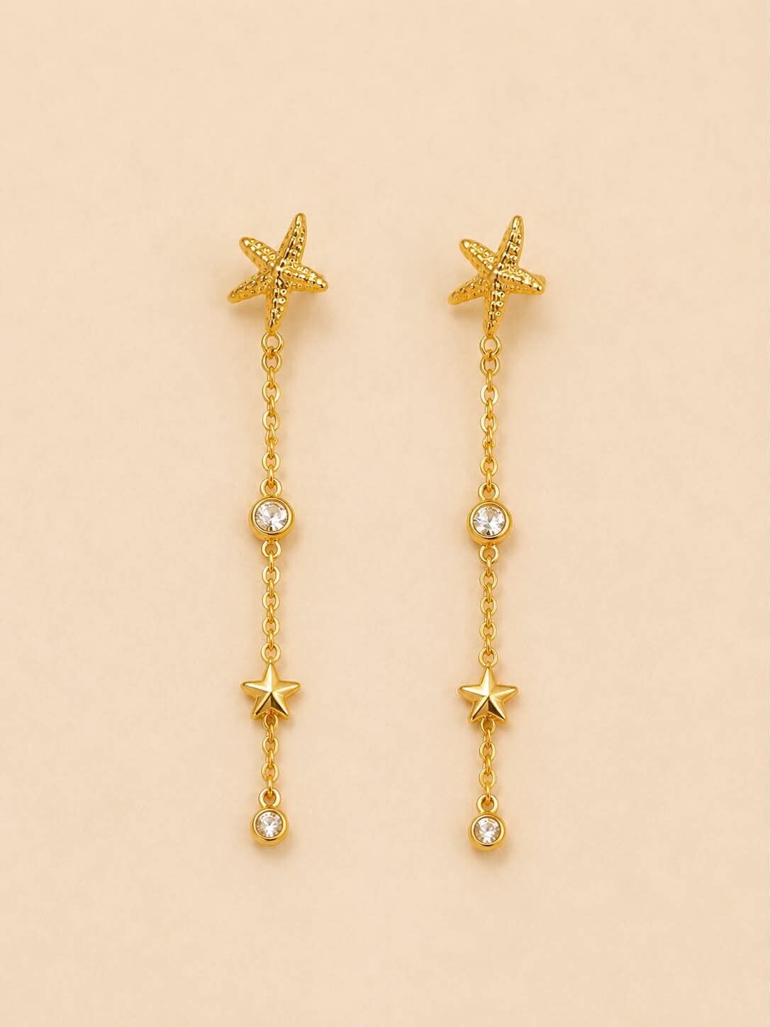 Boucles d'oreilles dorées pendantes étoiles de mer et strass