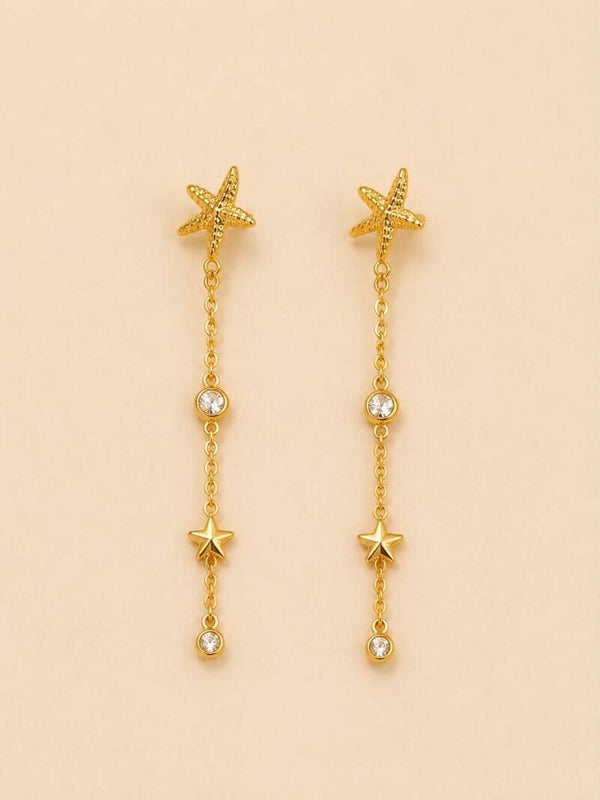Boucles d'oreilles dorées pendantes étoiles de mer et strass