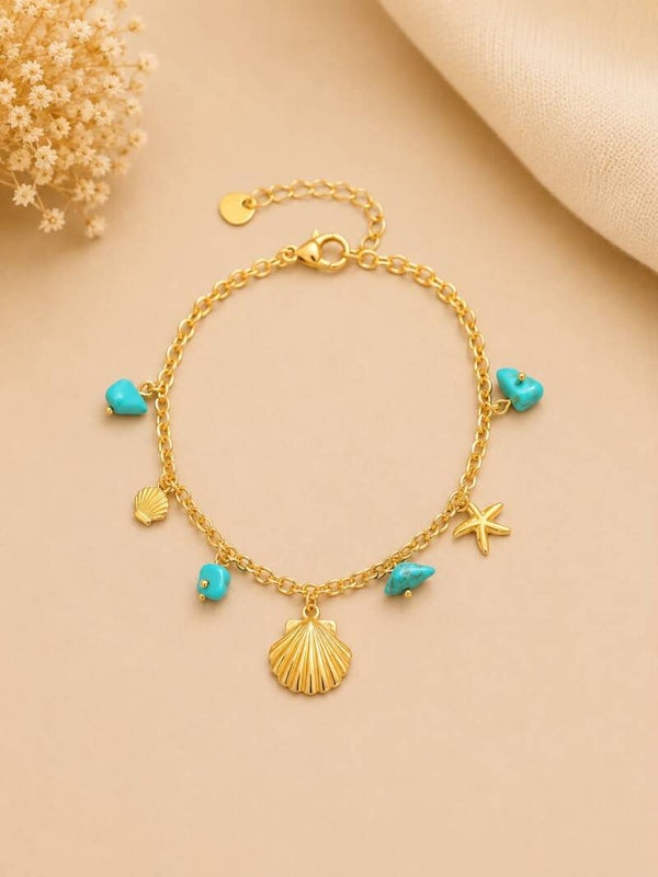 Chaîne de cheville dorée à pierres turquoise et charms marins