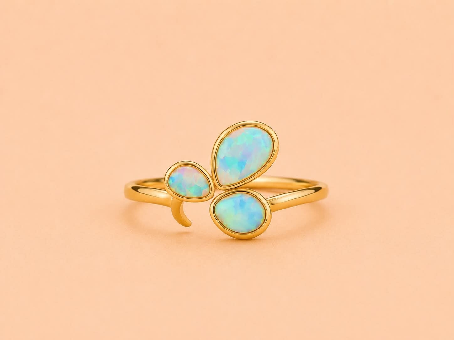 Bague dorée ajustable ornée de 3 pierres irisées Bleu