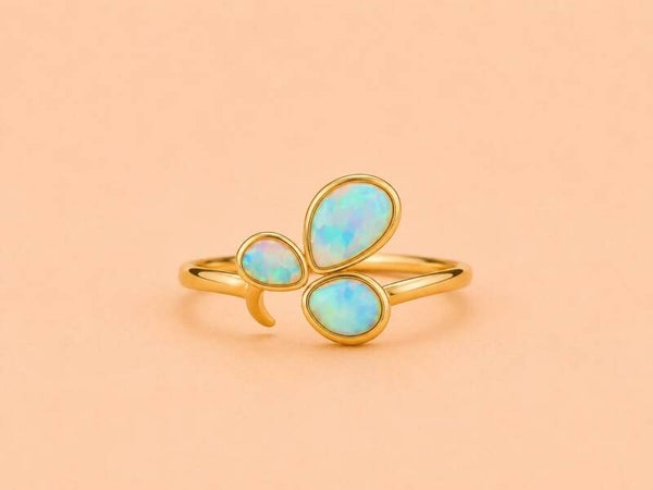 Bague dorée ajustable ornée de 3 pierres irisées Bleu