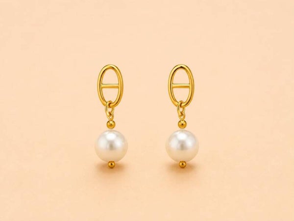 Boucles d'oreilles dorées ovales et perle pendante