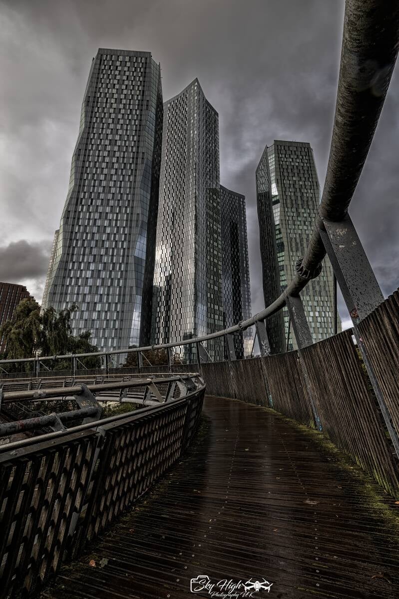  Moody Manchester cityscape with skyscrapers in the rain . Photography workshop 