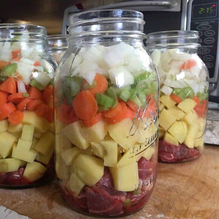 jar of raw meat and vegetables for canning