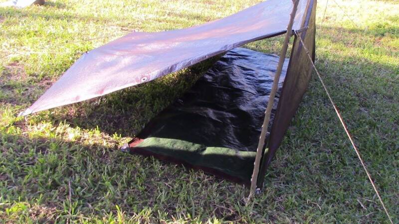 a lean-to shelter made from a tarp.
