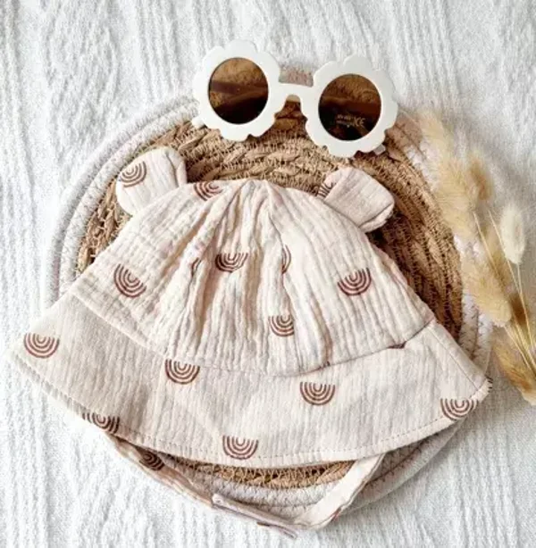Chapeau de soleil en mousseline pour bébé - Beige avec arc-en-ciel  Rammelaartje Rammelaartje