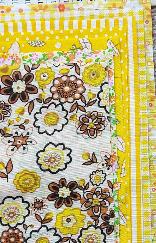 Yellows 25cm x 25cm Cotton Fabric. 7 Pieces