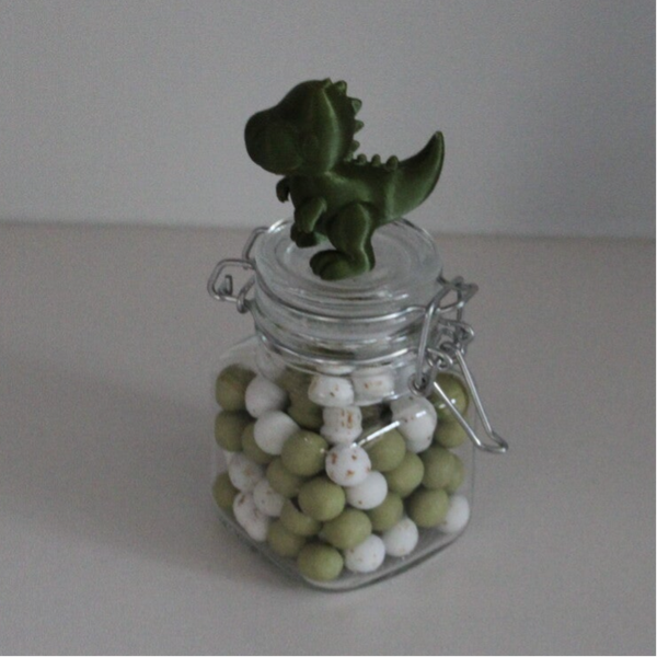 Glazen potje met wekpotsluiting en dino erop