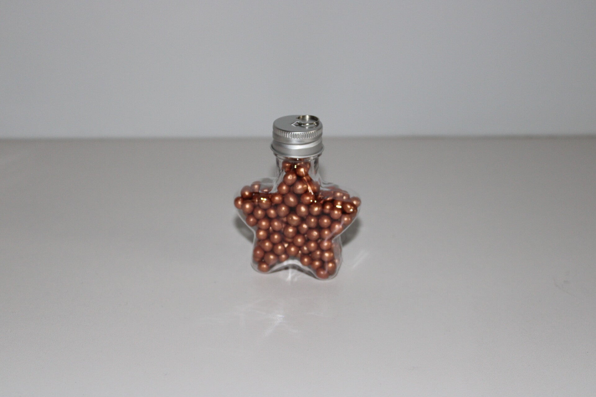 Ster gevuld met gouden of bronzen minicrispies