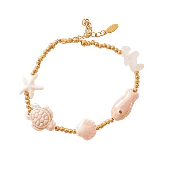 Rozenkwarts armband met zeebedels en kralen goud