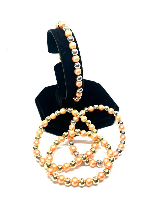 Parelmoer kralenarmband (S) met goud- of zilverkleurige details