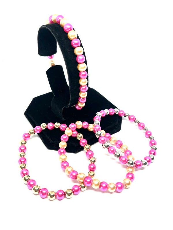 Roze kralenarmband (S) met parelmoer, goud- of zilverkleurige details