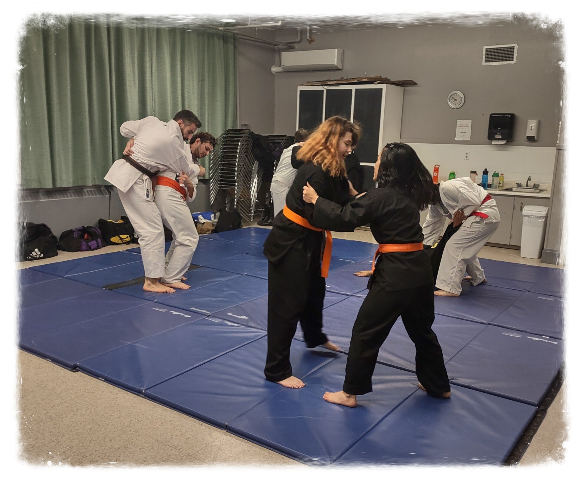 students learning upright grappling