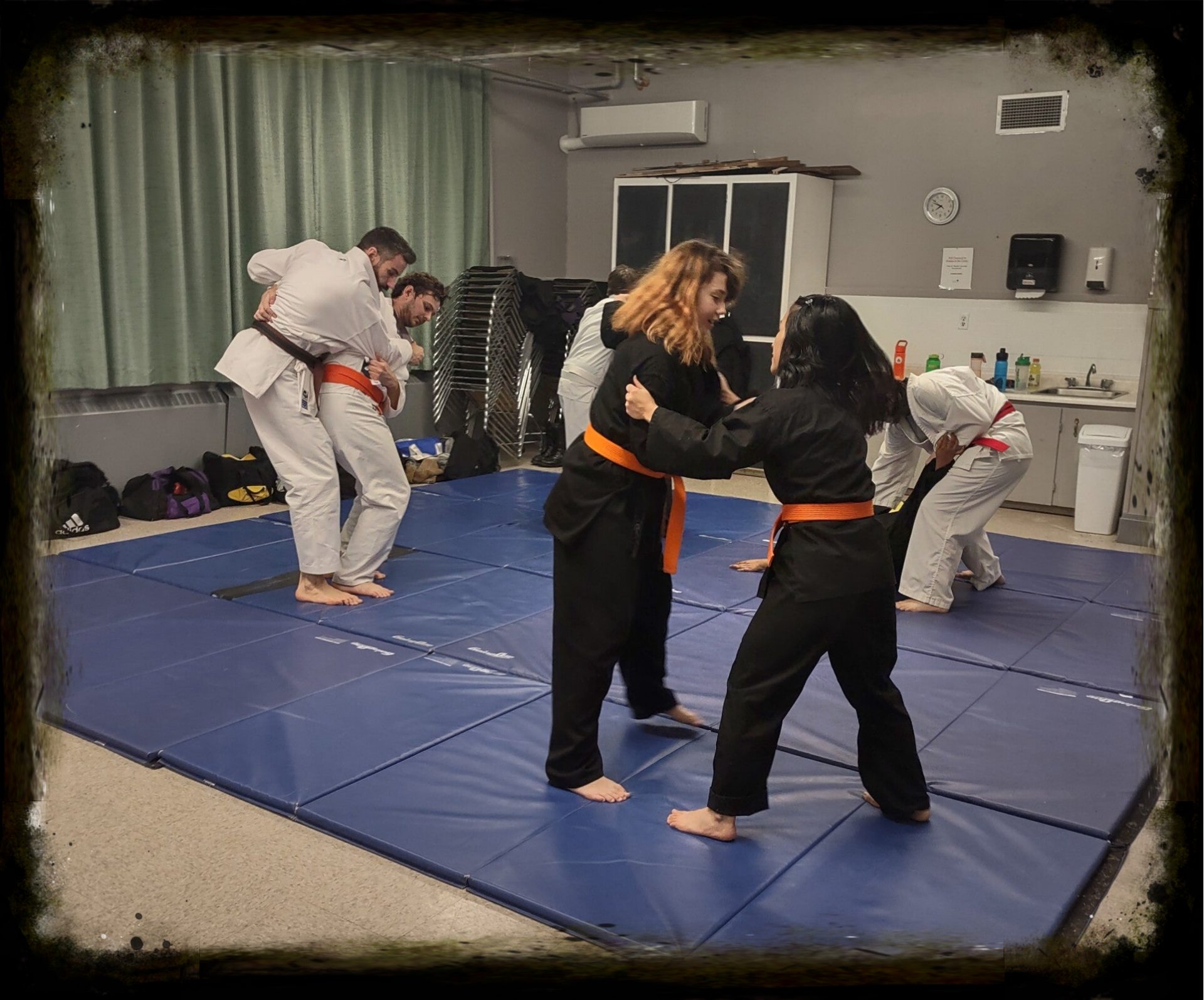 students learning upright grappling