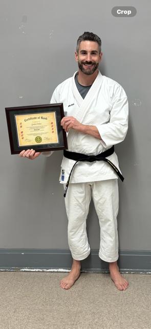 Gordon Delano receiving Black Belt
