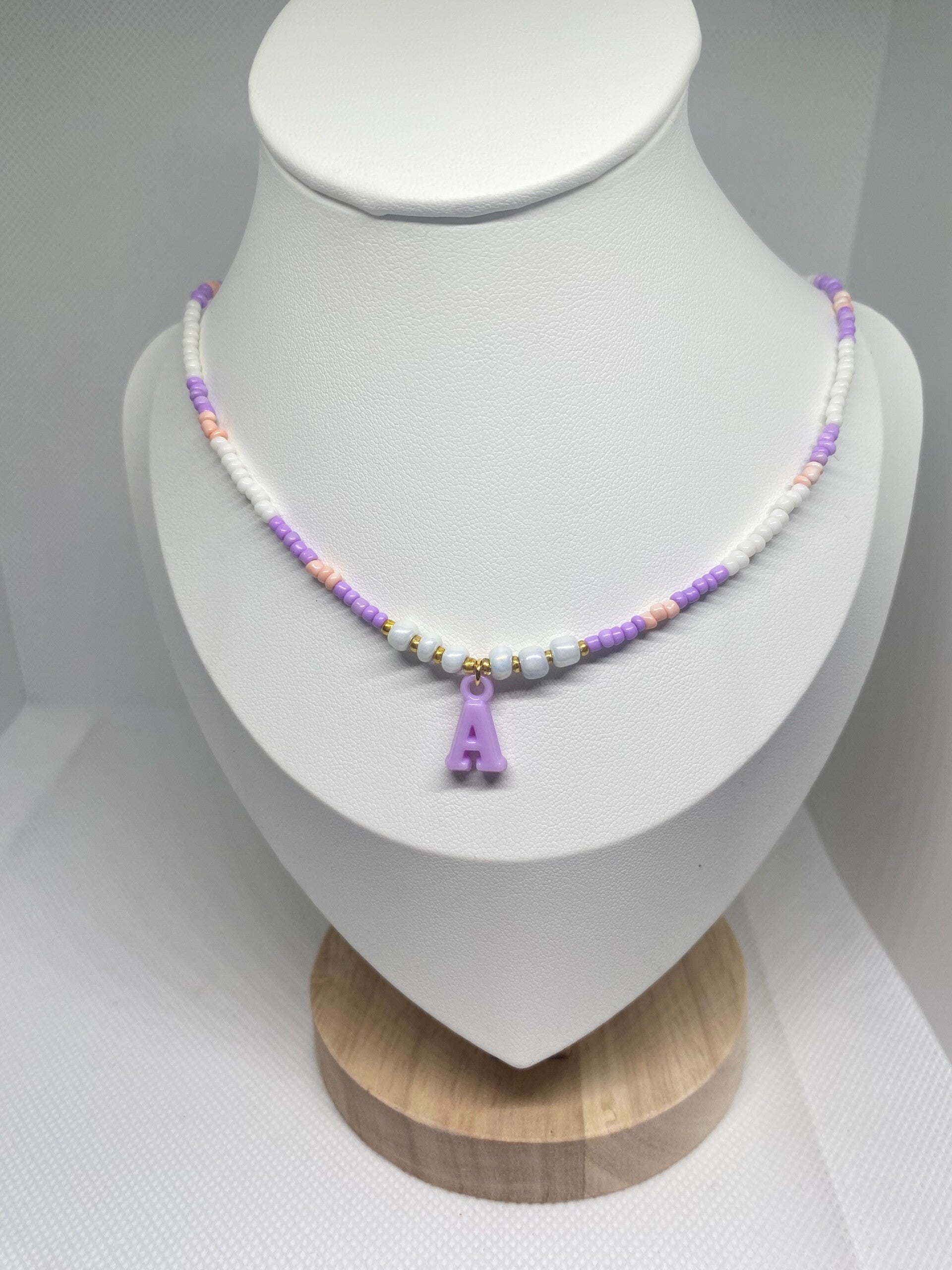 Ketting goud sluitinkje - paars met wit