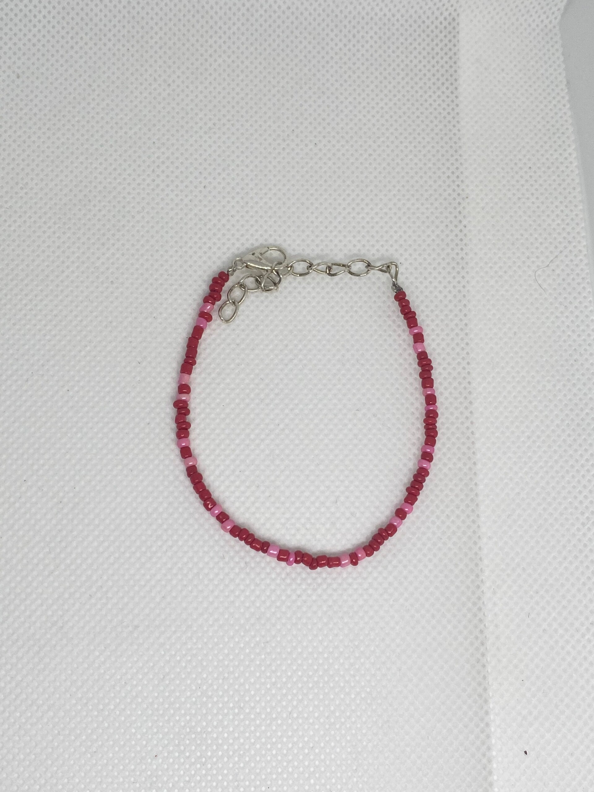 Armband zilver sluitinkje - rood met roze