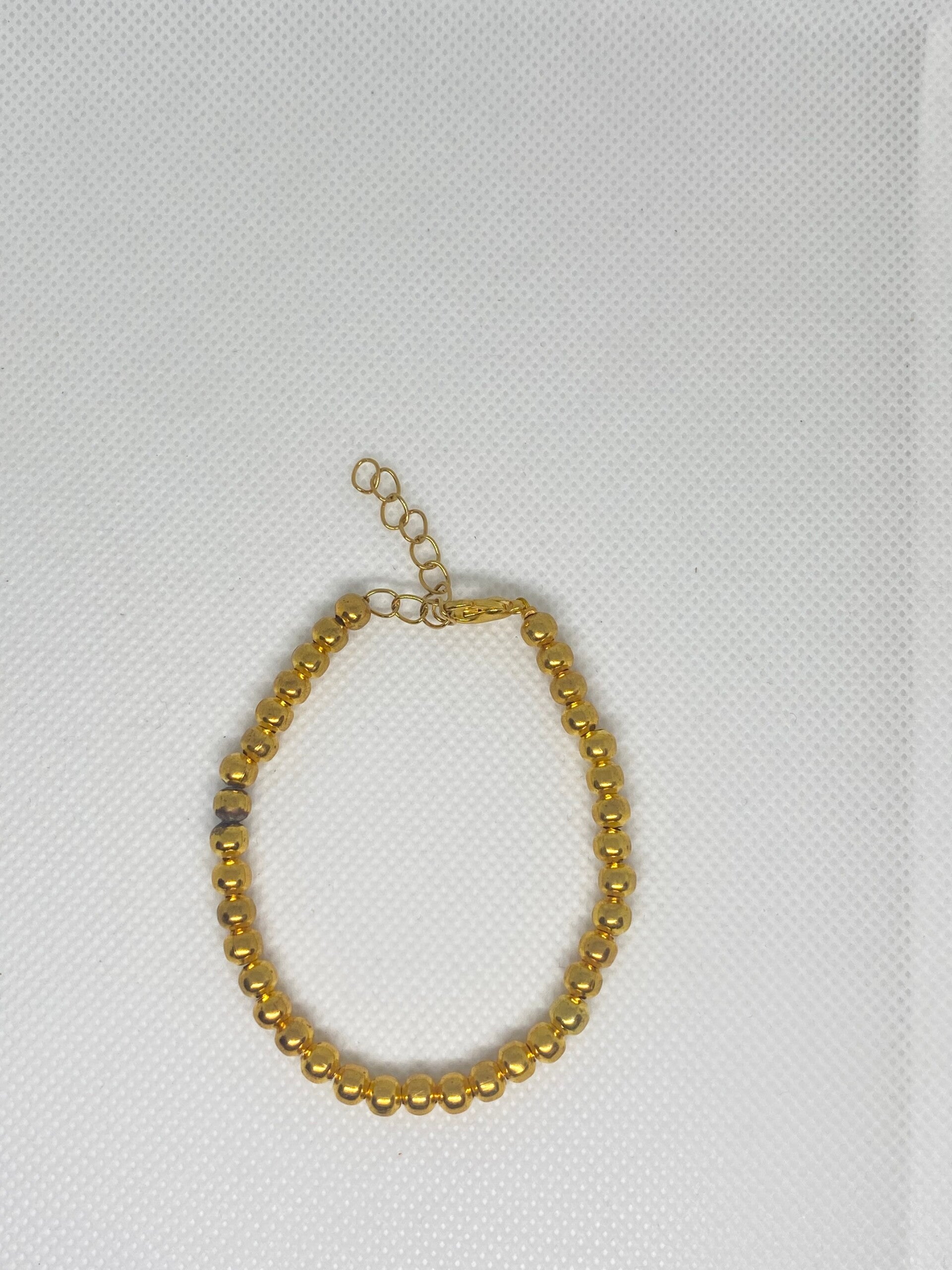 Armband goud sluitinkje - gouden kralen