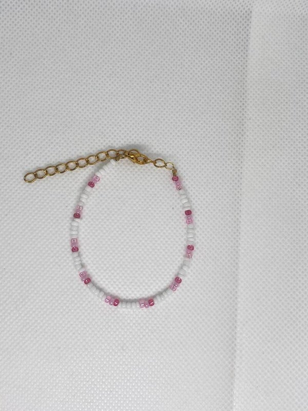 Armband goud sluitinkje - wit met roze