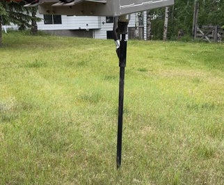 Excavator marking and prepping residential yard for septic rejuvenation