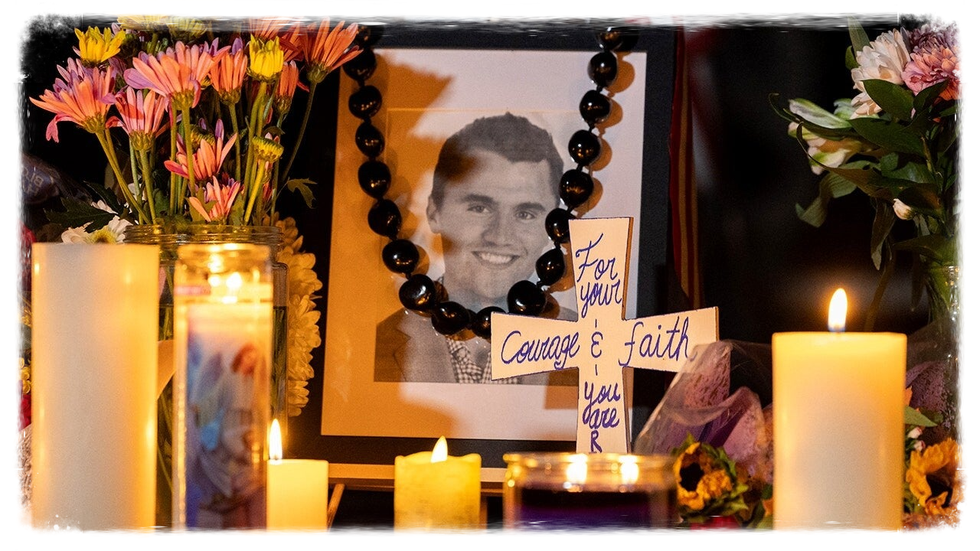 Memorial for Charlie Kirk with flowers, picture of Charlie Kirk. A Cross and candles