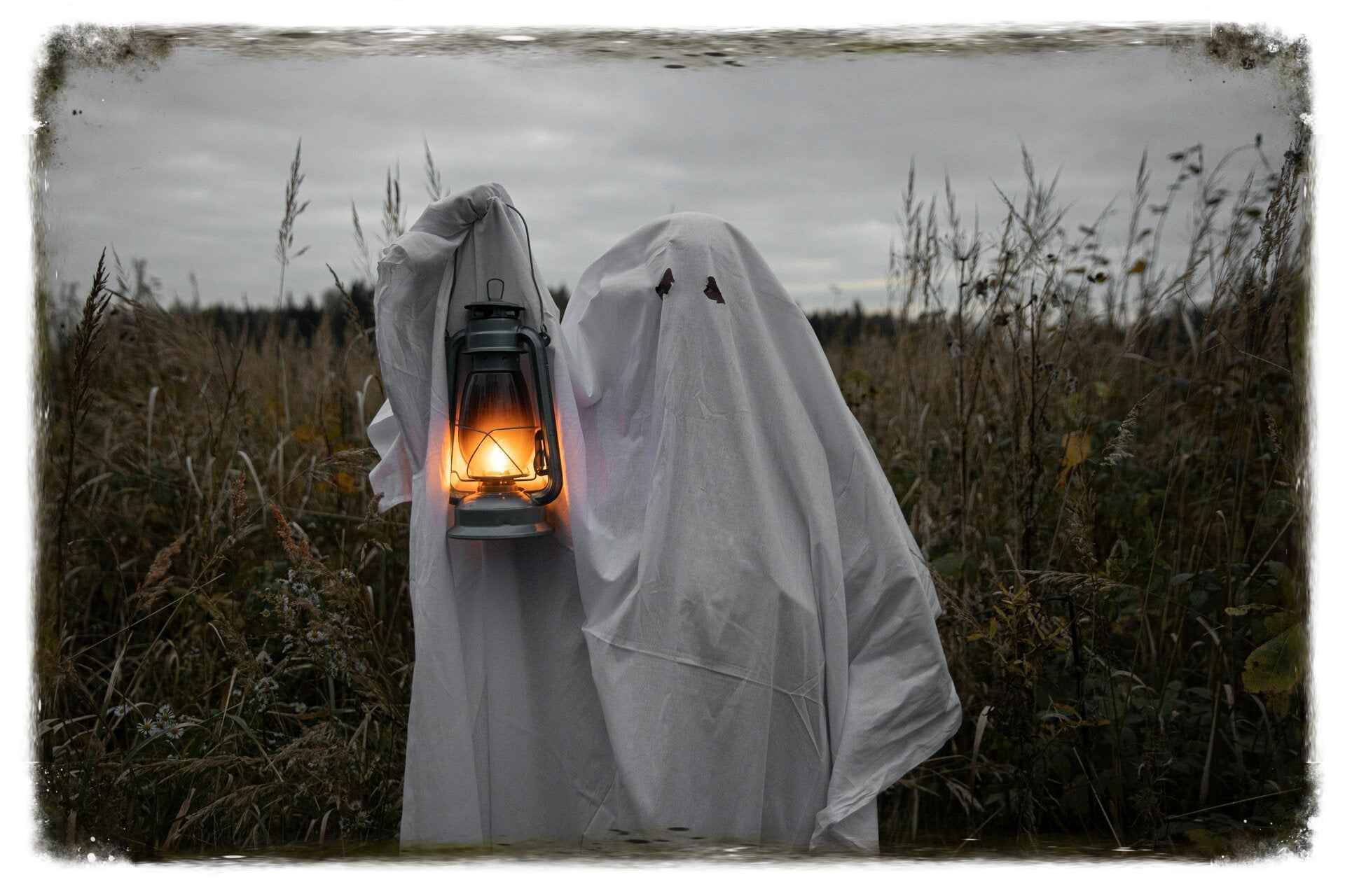 Ghost in field with lantern