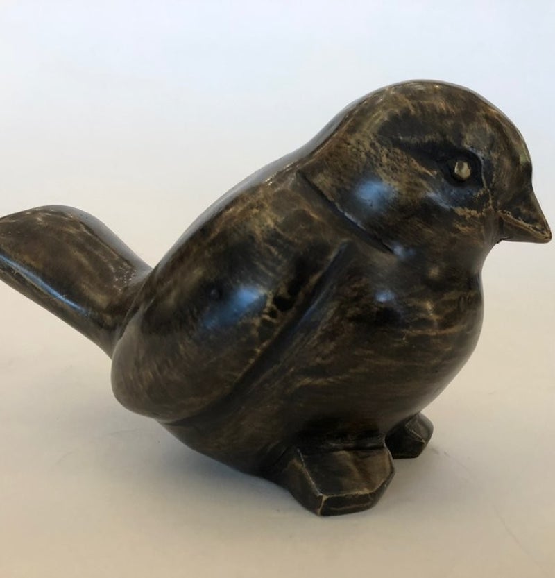 Licht abstract bronzen beeld van een dikke huis mus.