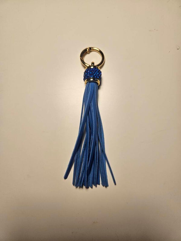 Tofs/nyckelring med strass i blå färg