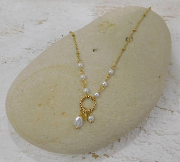 Collier acier cercle et perles nacrées - doré